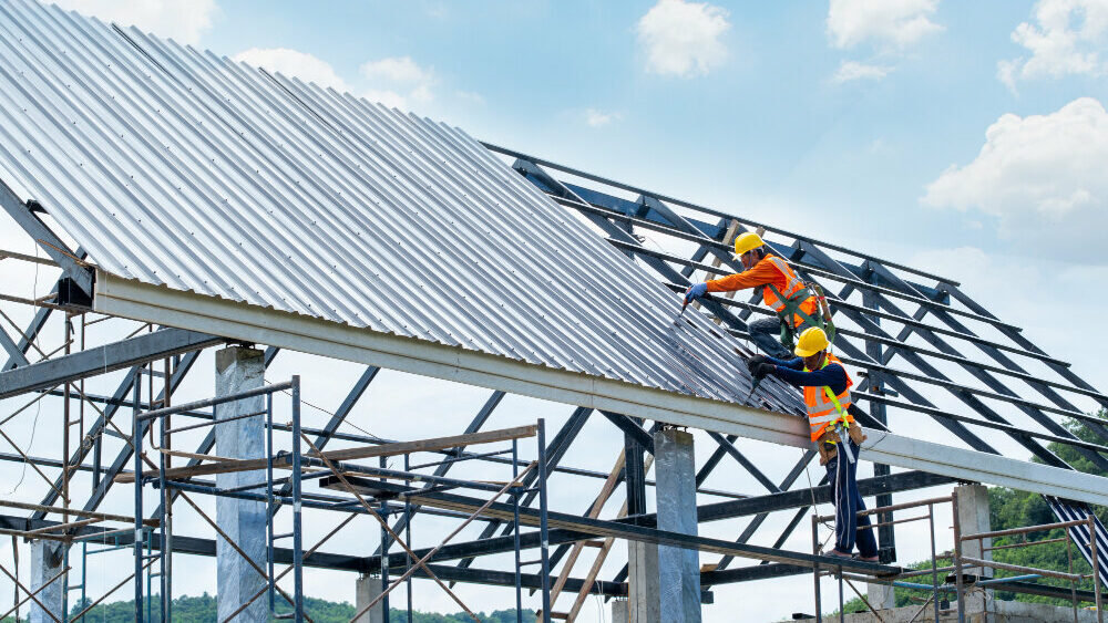 roofers installing a new roof in a construction site