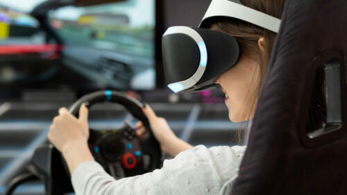 a girl using driving simulators to improve driving skills