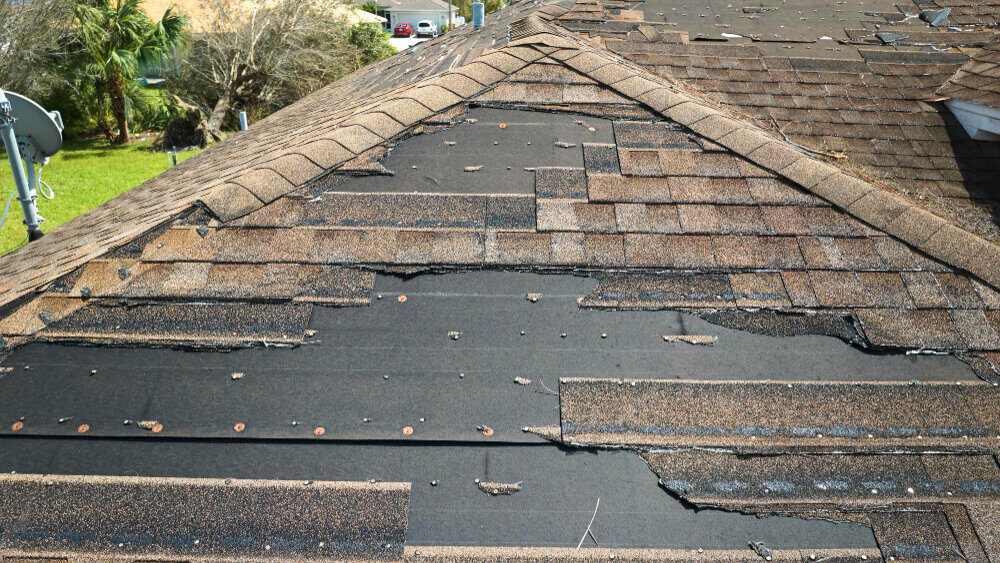 roof with missing and broken shingles